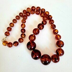 Vintage necklace with chunky graduated faux amber Lucite plastic round beads.